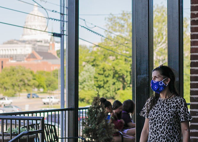 Mayor Carrie Tergin wears a mask June 24, 2020, while standing on the porch of River Park during a ceremony for the Historic City of Jefferson's Golden Hammer Award.
