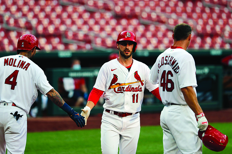 Paul DeJong is congratulated by Cardinals teammates Yadier Molina and Paul Goldschmidt after hitting a two-run home run during Thursday's intrasquad game at Busch Stadium.