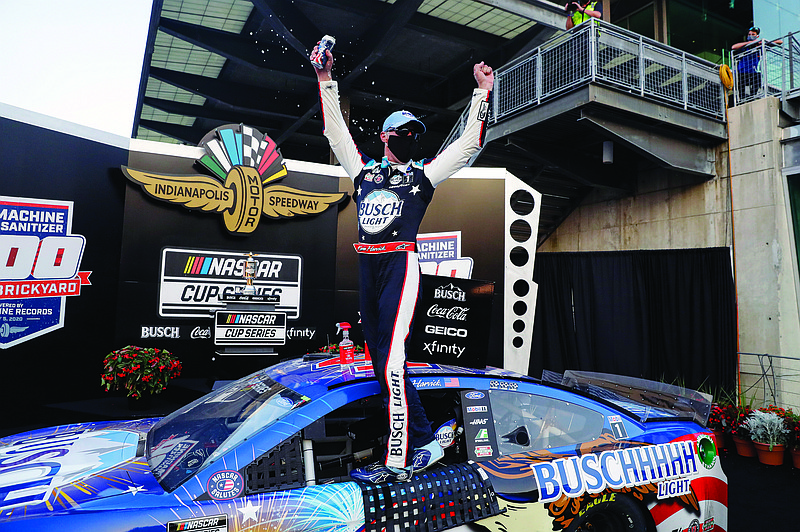Kevin Harvick celebrates Sunday after winning the NASCAR Cup Series race at Indianapolis Motor Speedway in Indianapolis.