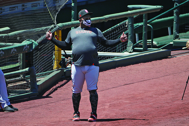 Pablo Sandoval of the Giants stands on the field during Sunday's practice in San Francisco.