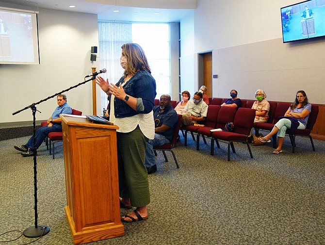 Beth Snyder, left, owner of 1Canoe2 and other businesses, spoke in favor of introducing a ordinance making wearing a face mask in Fulton. Protecting Fulton against a surge in cases will help protect area businesses against further losses, she argued.   