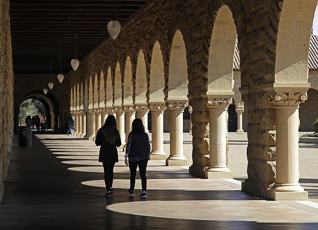  Students walk on the Stanford University campus March 14, 2019, in Santa Clara, Calif. Even with a fresh victory on behalf of international students, U.S. universities fear they're losing a broader fight over the nation's reputation as a place that embraces and fosters the world's best scholars. 