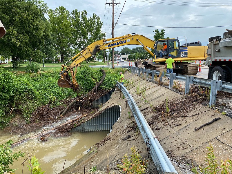 Crews clean up storm damage on Southwest Boulevard in Jefferson City on Monday, July 20, 2020.