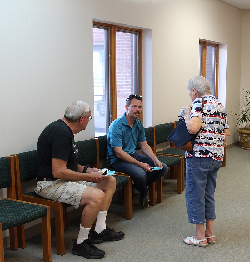 <p>Democrat photo/Austin Hornbostel</p><p>Dr. Nathan Granneman, outgoing doctor at Jefferson City Medical Group’s Family Health Clinic in California, chats with a pair of his patients at his farewell reception on Sunday. Granneman will join Big Tree Medical in Boonville.</p>