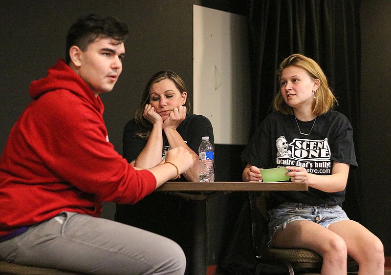 From left to right, Giovanni Acosta, Tammy Acosta and Erin Lammers practice their lines during a Short Attention Span Theatre skit rehearsal Monday evening at Scene One Theatre. In the original skit, Rebekah, played by Lammers, meets three different men while speed dating who all come with their own flare. Short Attention Span Theatre's 12th performance opens Thursday, July 30. Tickets are $10 and reservations must be made. Greta Cross/ News Tribune