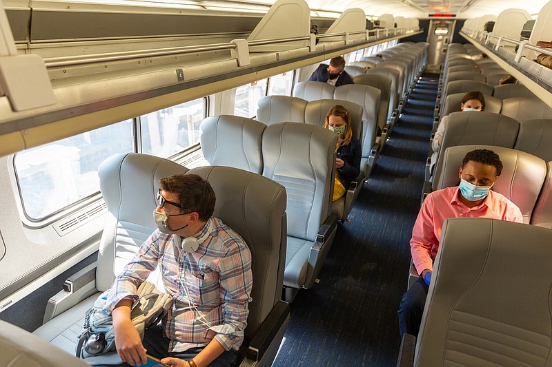 Passengers wear masks on an Amtrak train. (Amtrak handout photo)