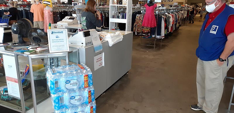 Stacks of bottled water cases are building at Goodwill of Texarkana, Texas. 