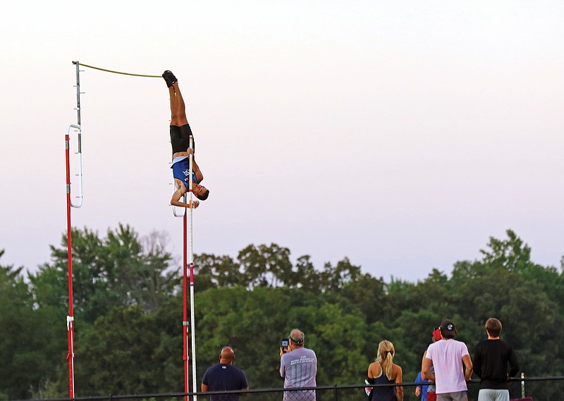 KC Lightfoot approaches the bar Friday during the pole vault in the Russellville Summer Series meet in Russellville. Lightfoot, a Baylor University junior from Lee's Summit, cleared 19 feet, 1.25 inches.