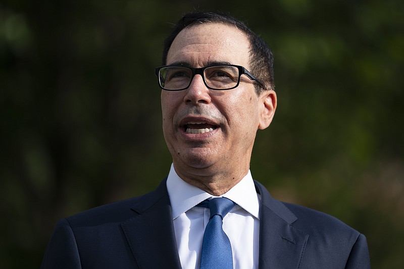 Treasury Secretary Steven Mnuchin speaks with reporters about the coronavirus relief package negotiations, at the White House, Thursday, July 23, 2020, in Washington. (AP Photo/Evan Vucci)