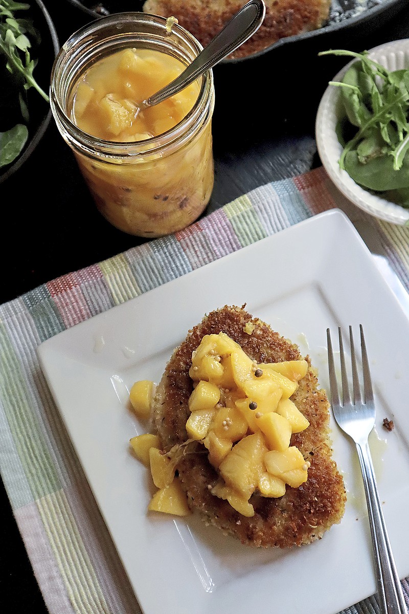 Pickled peaches add a bright, summery note to fried pork chops. (Gretchen McKay/Pittsburgh Post-Gazette/TNS)