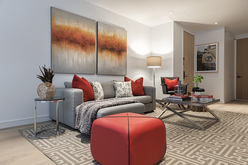Two pieces of bright artwork in a series perks up a family room. (Design Recipes/TNS) 