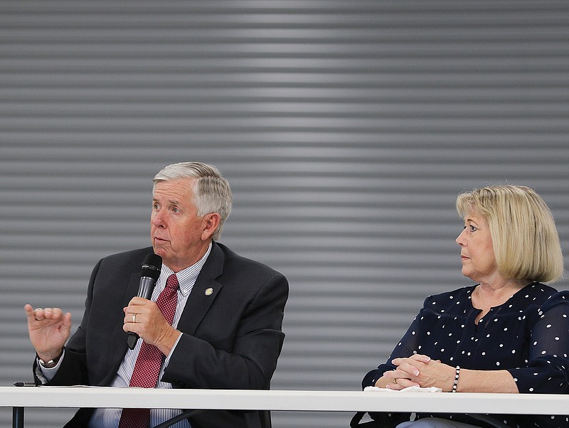 Missouri Gov. Mike Parson and first lady Teresa Parson meet Tuesday, July 28, 2020, at Capital City High School in Jefferson City with school superintendents from across the state to discuss reopening plans for schools in the fall.