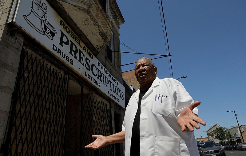 Standing outside his looted Roseland Pharmacy on June 12, 2020, in Chicago, longtime pharmacy owner Howard Bolling discusses his years as a pharmacist. (Antonio Perez/Chicago Tribune/TNS)