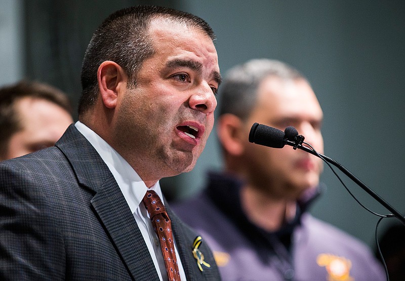 Dallas Police Sergeant Mike Mata, president of the Dallas Police Association, announces to the media that pension negotiations between police and fire associations and the city of Dallas have failed, in a Thursday, January 26, 2017 photo, at the Dallas Police Association headquarters in Dallas. A Texas grand jury will not indict Mata, accused of tampering with evidence in the case of a white Dallas police officer who fatally shot her unarmed Black neighbor. (Ashley Landis/The Dallas Morning News via AP)