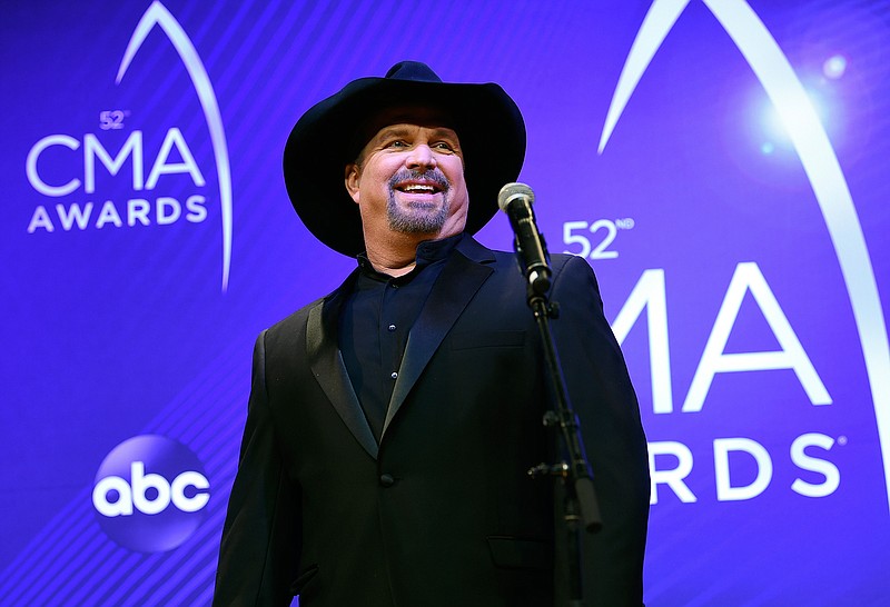 Singer/songwriter Garth Brooks appears at the 52nd annual CMA Awards in Nashville, Tenn. on Nov. 14, 2018. Brooks says he is pulling himself out of nominations for the Country Music Association's entertainer of the year award, saying it's time for someone else to win the top prize. Brooks, who won the top prize last November, said during an online press conference on Wednesday that he doesn't want to be nominated in any upcoming years as well. (Photo by Evan Agostini/Invision/AP, File)