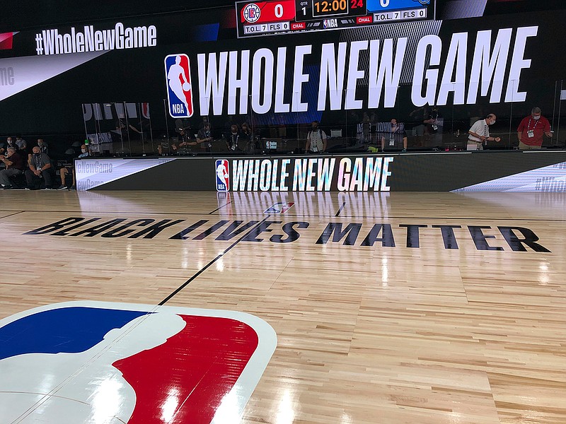 A basketball court is shown at the ESPN Wide World of Sports complex in Kissimmee, Fla., Tuesday, July 21, 2020. The NBA's marketing motto for the restart of the season at Walt Disney World is "Whole New Game," and in many respects, that's very true. (AP Photo/Tim Reynolds)