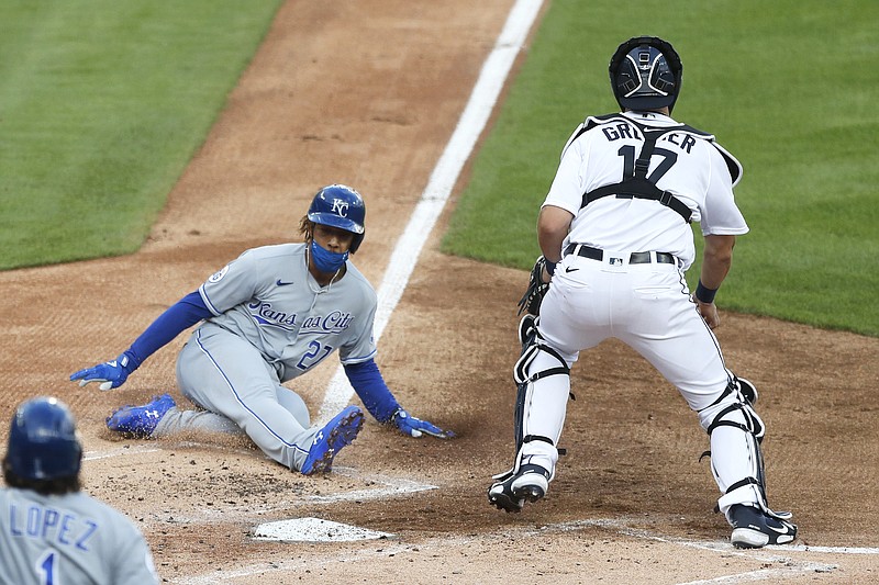 Adalberto Mondesi of the Royals beats the throw to Tigers catcher Grayson Greiner to score from third on a sacrifice by teammate Bubba Starling during the second inning of Wednesday night's game in Detroit.