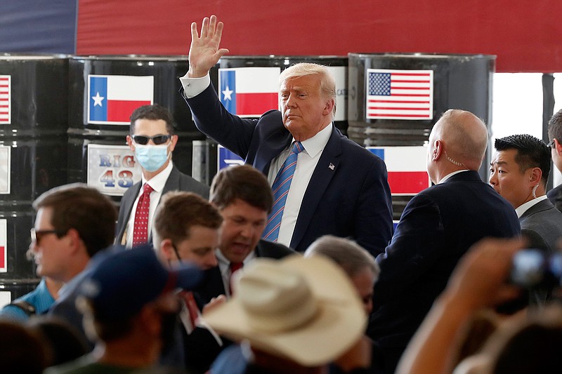 President Donald Trump waves to supporters after delivering remarks about American energy production during a visit to the Double Eagle Energy Oil Rig, Wednesday, July 29, 2020, in Midland, Texas. The president also tweeted about Texarkana's $3.6 million airport grant specifically on Wednesday, taking personal credit for "designating" the funds. "Great to help the people of Arkansas!" the tweet said. (AP Photo/Tony Gutierrez)