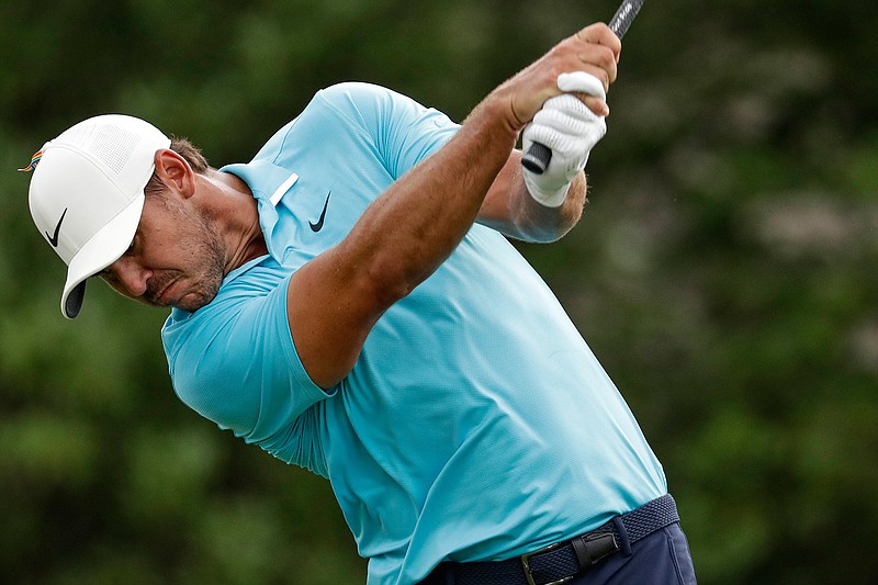 Brooks Koepka watches his tee shot on the 18th hole during the first round of the World Golf Championship-FedEx St. Jude Invitational Thursday, July 30, 2020, in Memphis, Tenn. (AP Photo/Mark Humphrey)