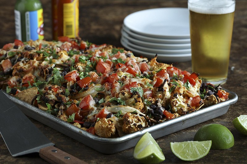 Roasted cauliflower becomes the star for a twist on nachos. It's still decadent with plenty of melted cheese, but also somewhat healthier than standard nachos. (Abel Uribe/Chicago Tribune/TNS) 