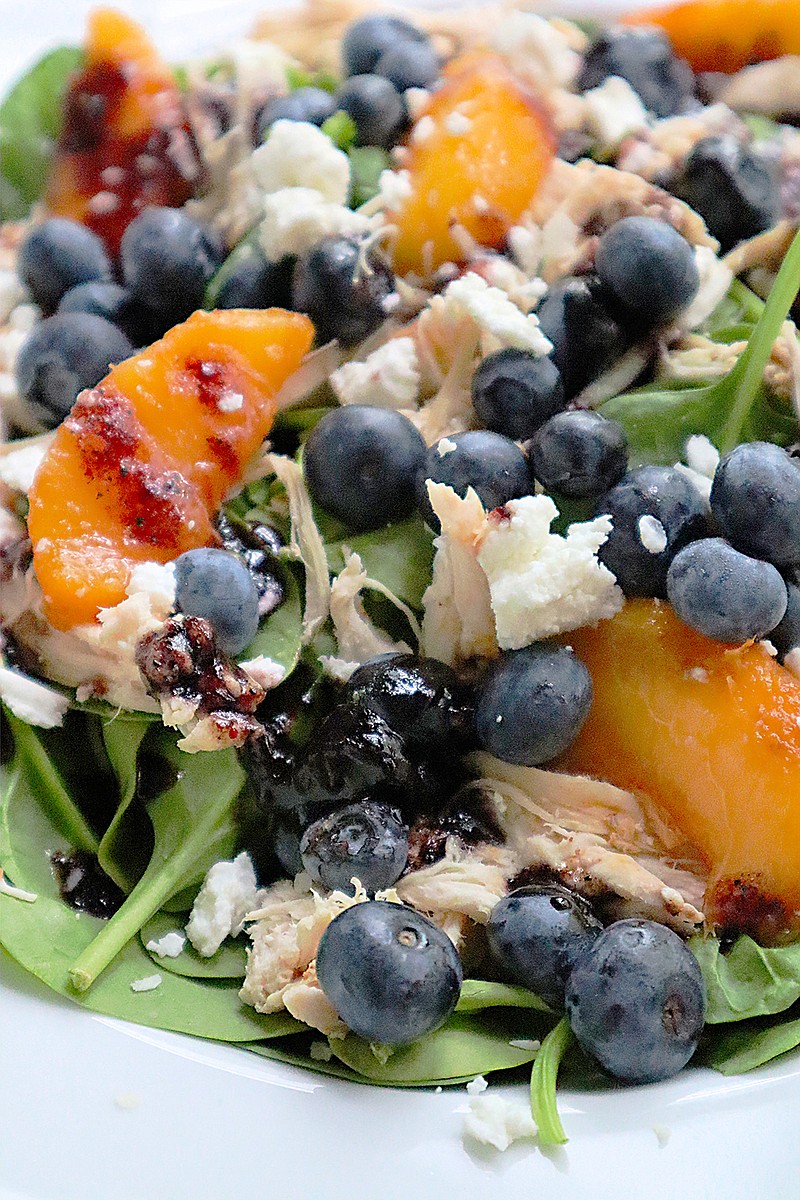 A handful of blueberries add antioxidants to a summer salad tossed with shredded chicken and peaches in a blueberry jam vinaigrette. (Gretchen McKay/Pittsburgh Post-Gazette/TNS)