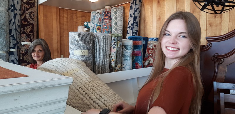 Donna Adams, left, and her daughter, Brooke, make sure the place is showing off the furniture in its best light. Full House Furniture is a local furniture shop offering curiosities and unique items.