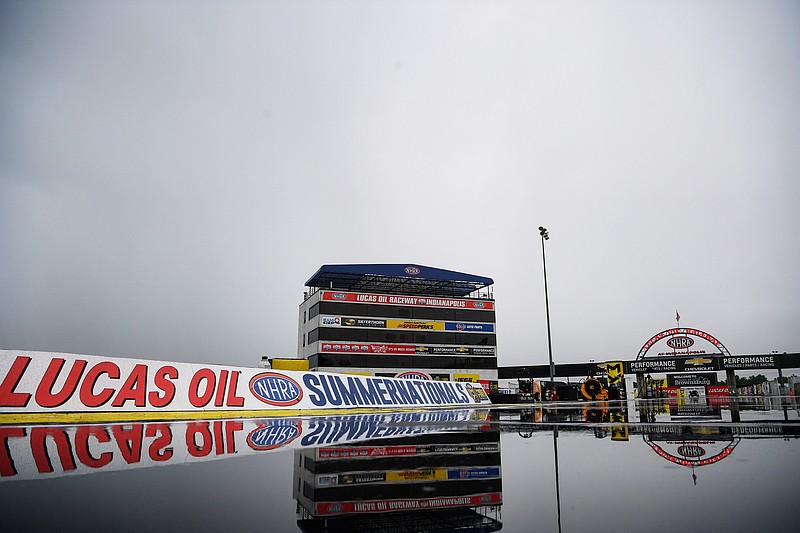 In this Julu 19 photo provided by the NHRA, water pools at Lucas Oil Raceway as the Lucas Oil NHRA Summernationals were postponed due to inclement weather in Indianapolis.
