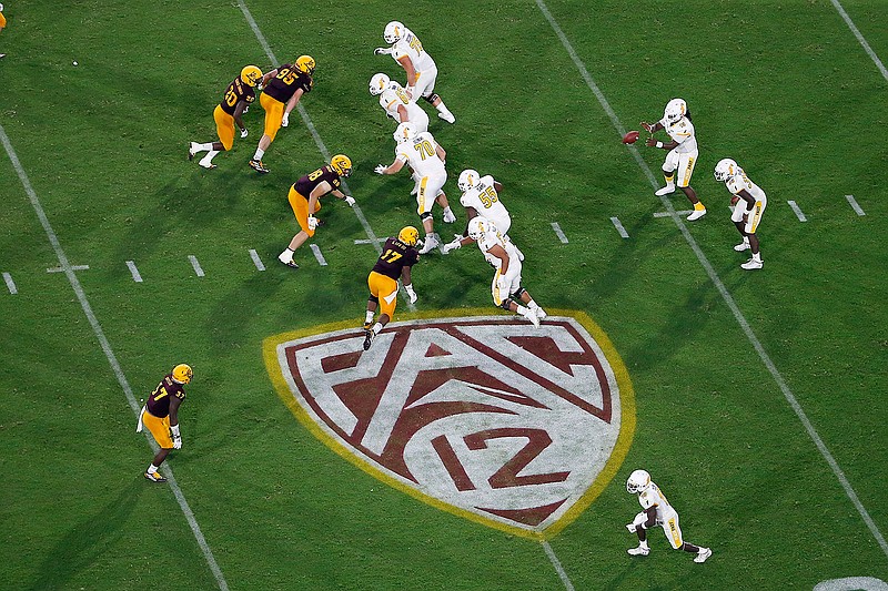 This Thursday, Aug. 29, 2019, file photo, shows the Pac-12 logo during the second half of an NCAA college football game between Arizona State and Kent State, in Tempe, Ariz. The Pac-12 has set Sept. 26 as the start of its 10-game conference-only football schedule. The Pac-12 announced three weeks ago it would eliminate nonconference games for its 12 member schools. (AP Photo/Ralph Freso, File)