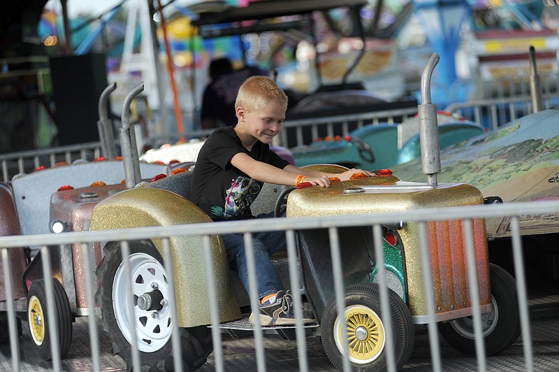 9-year old Micah Summers enjoys a midway ride during the 2020 Cole County Fair. Shaun Zimmerman/News Tribune