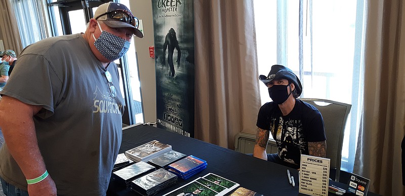 Author and documentarian Lyle Blackburn, right,  greets fans at the 2020 Fouke Monster Festival. Blackburn has spent years writing and putting together documentary films about the Fouke monster as well as other cryptids, strange rumored creatures that defy conventional explanation.