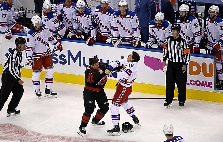 New York Rangers' Ryan Strome (16) fights with Carolina Hurricanes' Justin Williams during the first period in the NHL hockey Stanley Cup playoffs in Toronto, Saturday, Aug. 1, 2020. (Frank Gunn/The Canadian Press via AP)