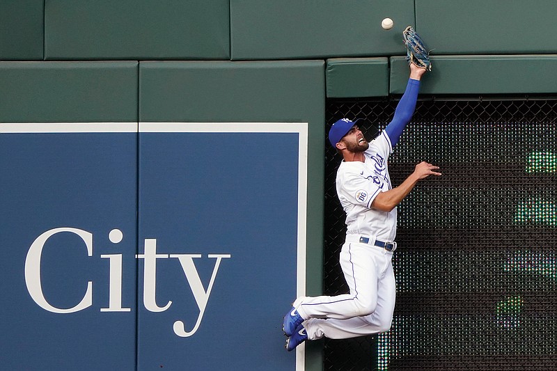 Royals center fielder Bubba Starling can't make the catch as a ball hit by Eloy Jimenez of the White Sox bounces out of his glove and over the wall for a three-run home run during the first inning of Saturday night's game at Kauffman Stadium.