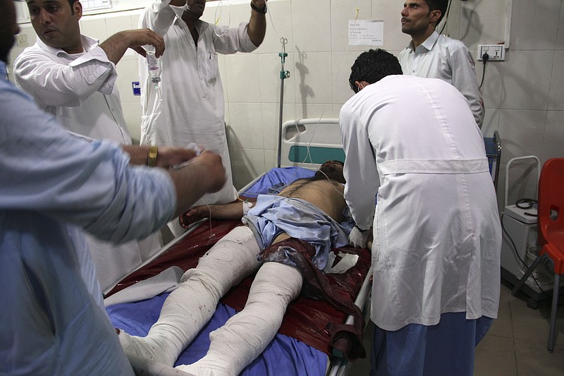 A wounded man receives treatment at a hospital after a suicide car bomb and multiple gunmen attack in the city of  Jalalabad, east of Kabul, Afghanistan, Sunday, Aug. 2, 2020. A suicide car bomb and multiple gunmen attacked a prison in eastern Afghanistan on Sunday, Afghan officials said, killing at least one person and injuring dozens. (AP Photo)