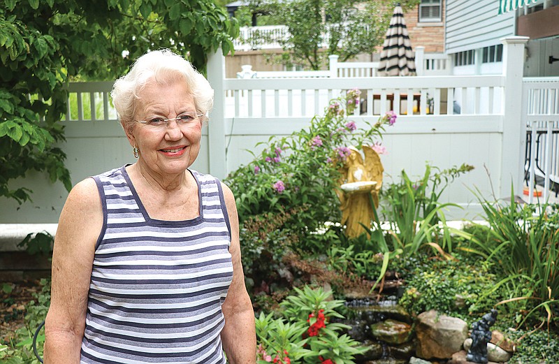 Mary Rehagen smiles for a portrait July 27 in her backyard in Jefferson City. Rehagen is a Republican supervisor for the Cole County Clerk's office.