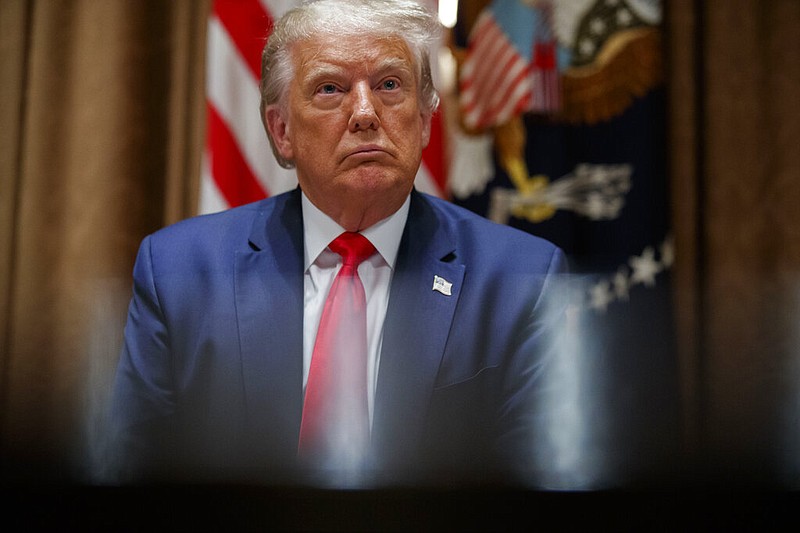 President Donald Trump listens during a meeting with U.S. tech workers, before signing an Executive Order on hiring American workers, in the Cabinet Room of the White House, Monday, Aug. 3, 2020, in Washington.