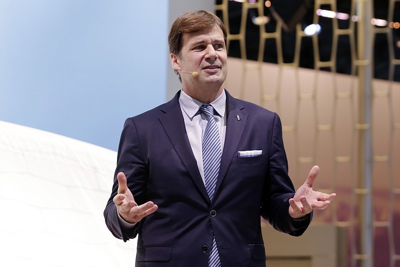 FILE - In this March 28, 2018 file photo, Jim Farley, Jr. executive vice president and president of Global Markets of the Ford Motor Company, is shown in this photo during New York International Auto Show.  Farley will lead the storied automaker into the future starting Oct. 1 2020, when current CEO Jim Hackett retires. The company has struggled in recent years and is in the midst of an $11 billion restructuring plan designed to make it leaner and crank out new vehicles to replace what was an aging model lineup. (AP Photo/Richard Drew, File)
