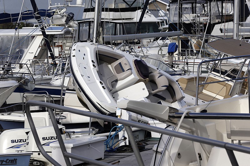 Boats are piled Tuesday, Aug. 4, 2020, on each other at the Southport Marina following the effects of Hurricane Isaias in Southport, North Carolina. (AP Photo/Gerry Broome)