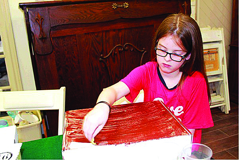 Raeleigh Beard puts together her travel trunk at the Ace of Clubs House. August is again Harry Potter month for the Texarkana Museums System. 