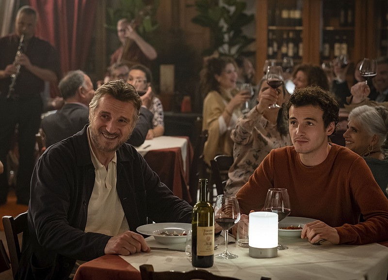 This image released by IFC Films shows Michaél Richardson, right, and his father Liam Neeson in a scene from "Made In Italy." They play father and son in the film but their characters are dealing with the loss of their wife and mother. Neeson's wife and Richardson's mother, Natasha Richardson, died over a decade ago in a skiing accident. (IFC Films via AP)