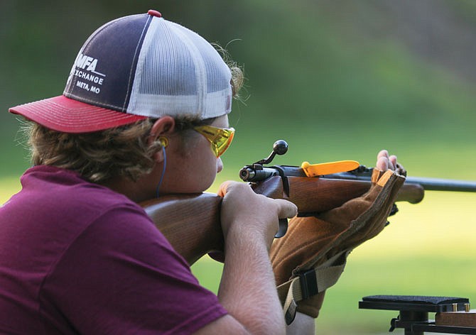 Chad Bittle focuses Wednesday while participating in the .22-caliber rifle shooting category of Cole County 4-H Shooting Sports' competition at United Sportsman's Club.