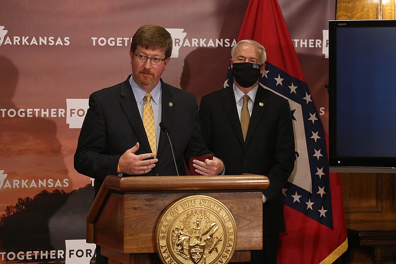 Secretary of Education Johnny Key (left) answers a question while Gov. Asa Hutchinson (right) listens during the daily covid-19 press briefing on Wednesday, Aug. 5, 2020, at the state Capitol in Little Rock. (Arkansas Democrat-Gazette/Thomas Metthe)