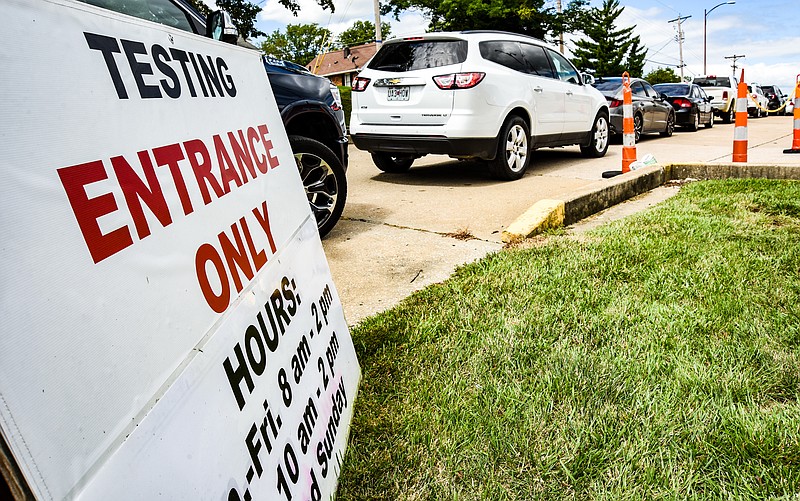 Julie Smith/News Tribune
Covid-19 testing continues at Capital Region Medical Center’s mobile testing site at 1014 Madison St. drivers were waiting in line by twos and the line continued over a block down the street. Testing is done by a doctor’s order and are performed between the hours of 8 a.m. to 2 p.m.