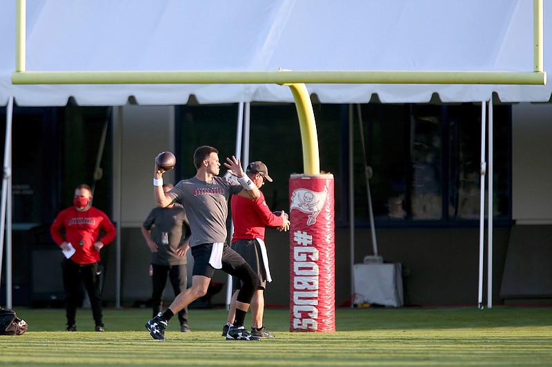 Tampa Bay Buccaneers quarterback Tom Brady (12) throws a pass during NFL football training camp, Tuesday, Aug. 4, 2020, in Tampa. (Douglas R. Clifford/Tampa Bay Times via AP)