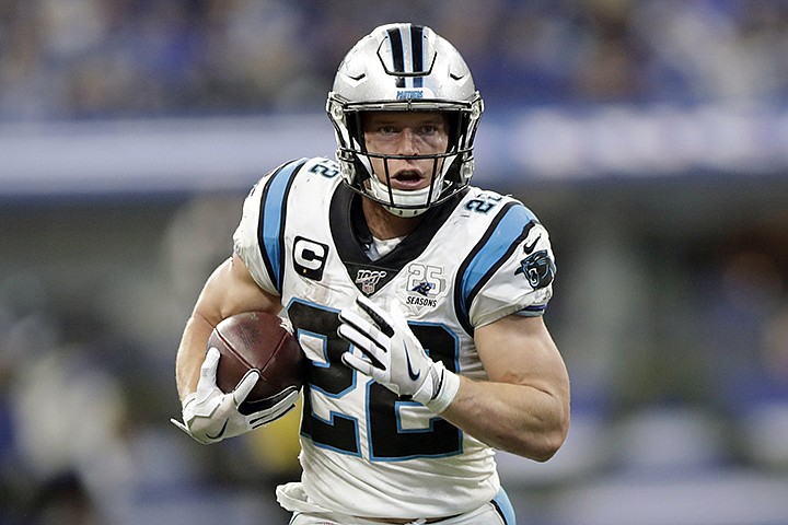 In this Dec. 22, 2019, file photo, Carolina Panthers' Christian McCaffrey runs during the second half of an NFL football game against the Indianapolis Colts, in Indianapolis. Christian McCaffrey has been one of the most used - and most productive -- running backs in the league over the last few years. Now that he has a big contract, he doesn't expect a letdown in usage. (AP Photo/Michael Conroy, File)