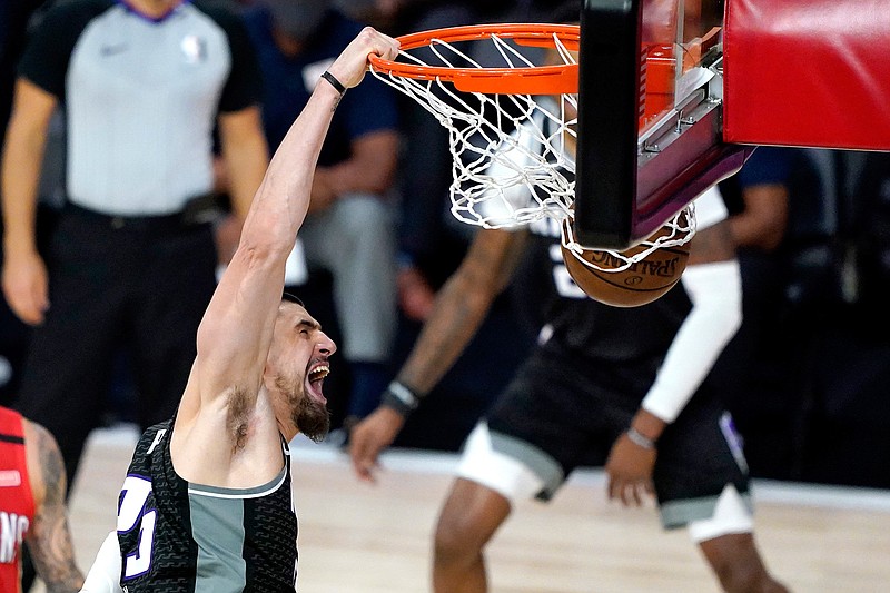 Sacramento Kings' Alex Len (25) reacts while dunking on the New Orleans Pelicans during the second half of an NBA basketball game Thursday, Aug. 6, 2020 in Lake Buena Vista, Fla. (AP Photo/Ashley Landis, Pool)