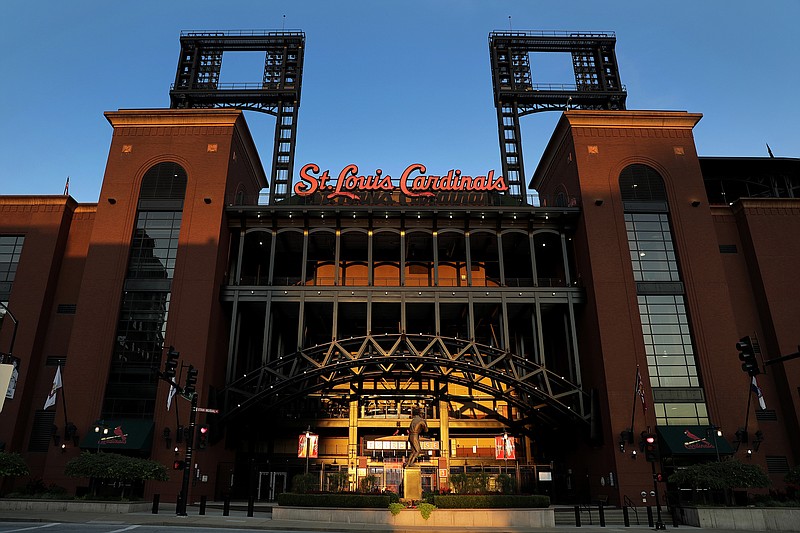 Busch Stadium, home of the Cardinals, remains quiet Friday in St. Louis after Major League Baseball announced the entire three-game series against the Cubs had been postponed.