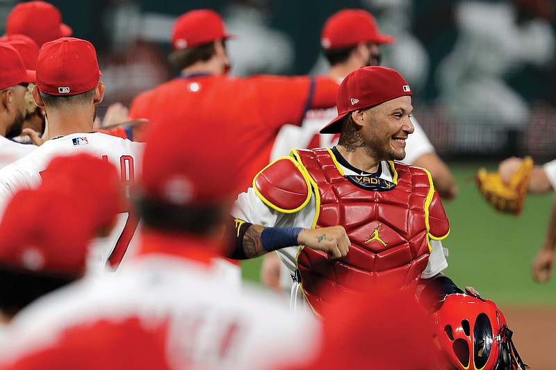 In this July 24 file photo, Cardinals catcher Yadier Molina celebrates a 5-4 win against the Pirates in St. Louis.  Molina was one of the players on his team who has tested positive for the coronavirus.