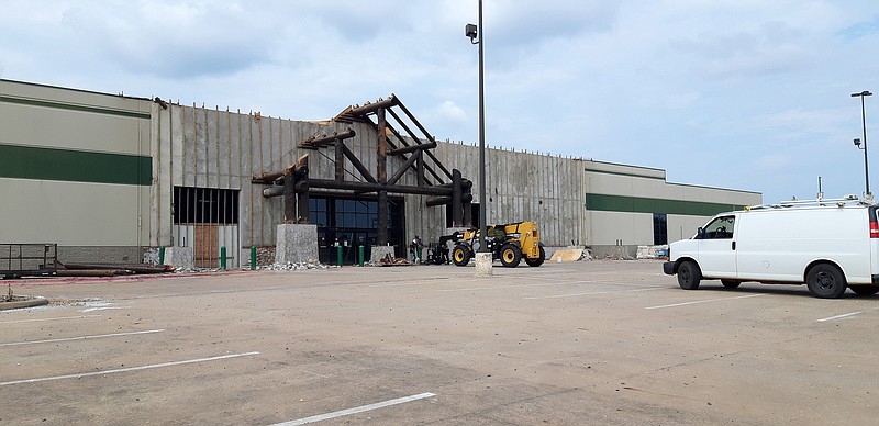Church On The Rock's project to refurbish the former Gander Mountain location as their new church building continued Friday. Recent projects include electrical work, lots of shelving and redoing of the front facade, with a noted log frame.