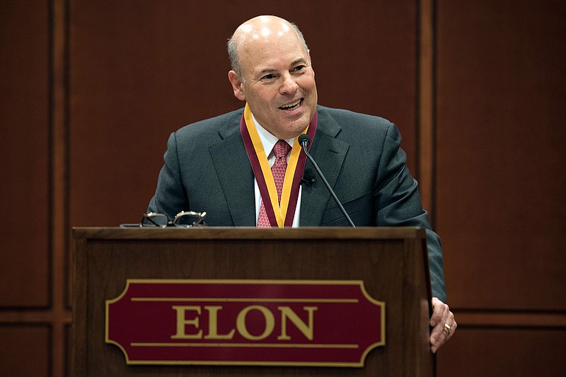 In this March 1, 2017, file photo, then Elon Trustee Louis DeJoy is honored with Elon's Medal for Entrepreneurial Leadership in Elon. N.C. U.S. Sen. Joe Manchin and union officials say the U.S. Postal Service is considering closing post offices across the country, sparking worries ahead the anticipated surge of mail-in ballots in the 2020 elections. Manchin on Wednesday, July 29, 2020 said he has received numerous reports from post offices and colleagues about service cuts or looming closures in West Virginia and elsewhere, prompting him to send a letter to Postmaster General Louis DeJoy asking for an explanation. (Kim Walker/Elon University via AP, File)