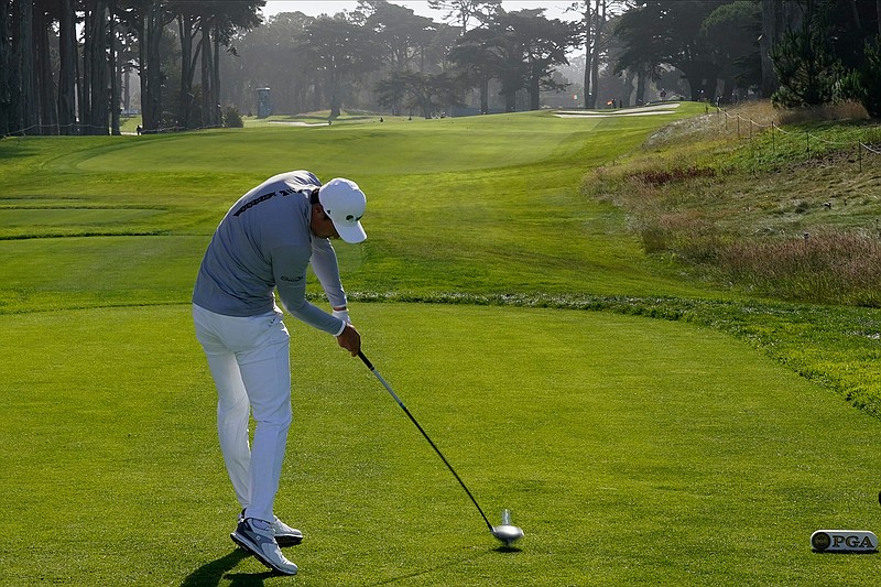 Li Haotong of China, hits his tee shot on the 10th hole during the second round of the PGA Championship golf tournament at TPC Harding Park Friday, Aug. 7, 2020, in San Francisco. (AP Photo/Charlie Riedel)